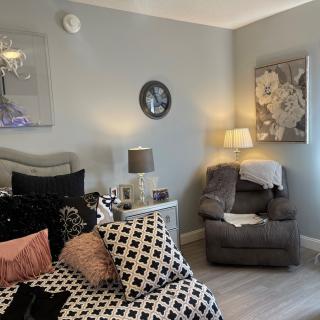 Cozy bedroom with stylish decor and comfortable seating.