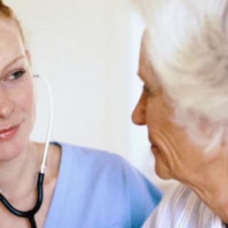 A medical professional attending to an elderly patient