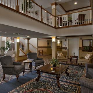 A spacious hotel lobby with comfortable seating and elegant decor.