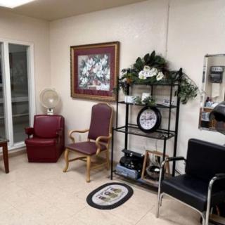 A cozy waiting room with various chairs and decorative elements.