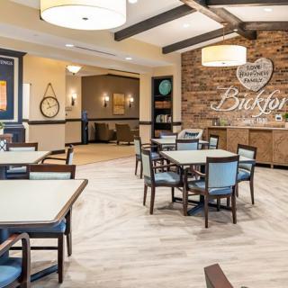A well-lit dining area with modern furniture and elegant decor.