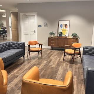 A cozy lounge area featuring stylish seating arrangements and modern decor.