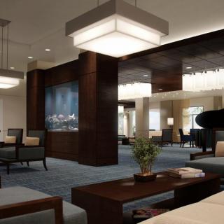 A modern and luxurious living room interior with elegant furniture and ambient lighting.
