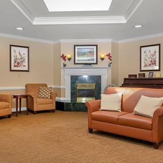 A cozy living room featuring comfortable seating and a fireplace.