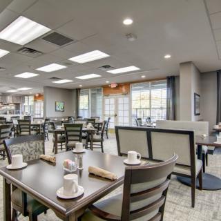 Modern restaurant dining area with neatly arranged tables and chairs.