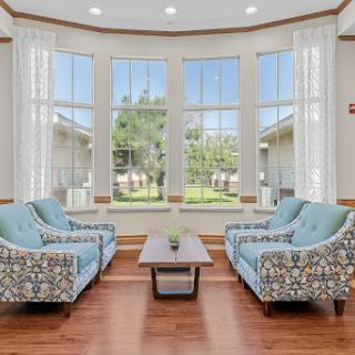 A cozy living room with stylish seating and abundant natural light.