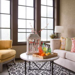 A cozy living room with modern furniture and elegant decor.