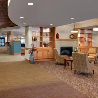 A cozy lobby with comfortable seating, decorative elements, and a welcoming atmosphere.