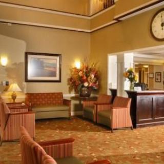 A welcoming hotel lobby with comfortable seating and a reception desk.