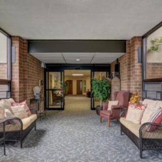 A spacious and welcoming lobby area with comfortable seating and decorative plants.