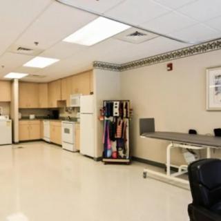A clean and well-equipped medical clinic treatment room.