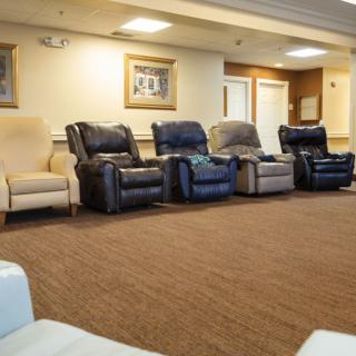 A row of comfortable recliners arranged in a living room setting.