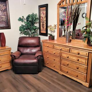 A cozy living room setup featuring wooden furniture and decor.