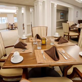 An elegantly set dining table in a well-appointed dining room.