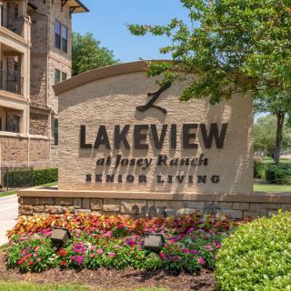 Entrance sign for Lakeview at Josey Ranch Senior Living surrounded by landscaping.