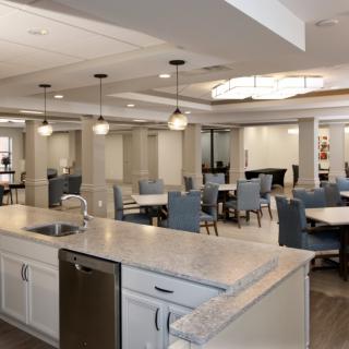 Modern dining area with elegant seating and lighting.