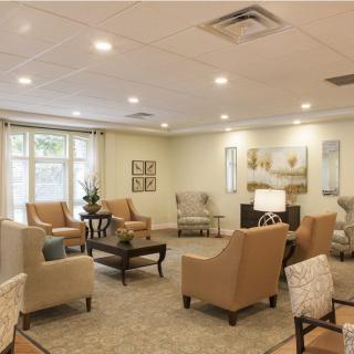 A cozy living room with comfortable seating and warm lighting.