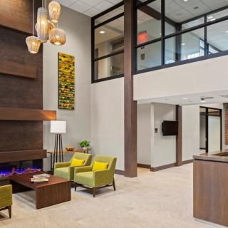 A modern lobby with stylish furniture and elegant lighting.