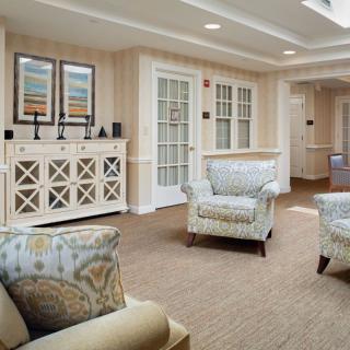 A cozy living room with comfortable chairs and elegant decor.