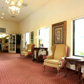 A spacious and elegantly decorated lobby area with comfortable seating and soft lighting.