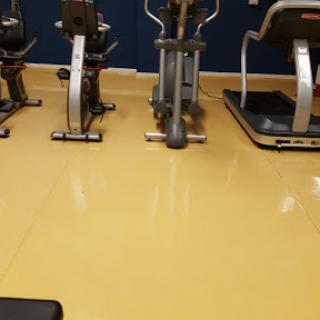 A view of exercise equipment in a gym setting.