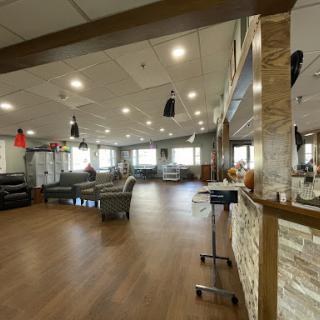 A spacious and modern lounge area featuring comfortable seating and stylish decor.