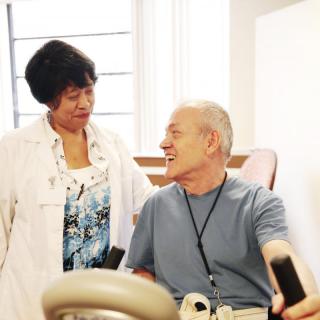 A doctor interacts with a patient during a medical consultation.