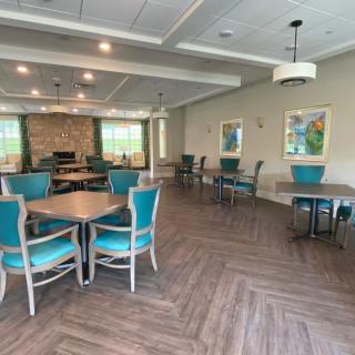 Spacious and modern dining area with elegant furnishings and decor.