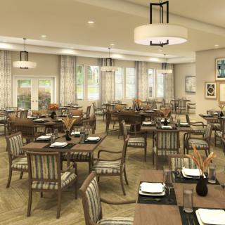 An elegantly designed dining area with neatly arranged tables and chairs, ready for guests.