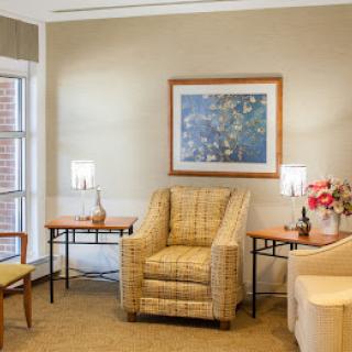 A cozy living room with comfortable armchairs and elegant decor.