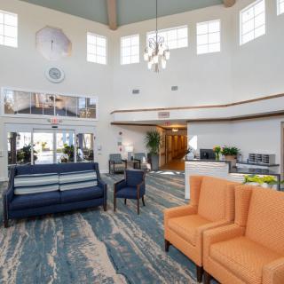 A spacious and modern lobby with comfortable seating and stylish decor.