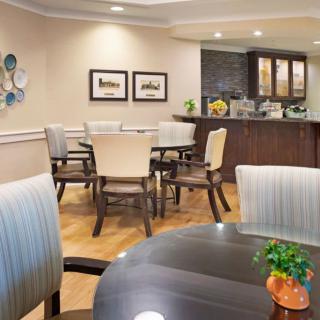 Cozy dining area with modern decor and comfortable seating.