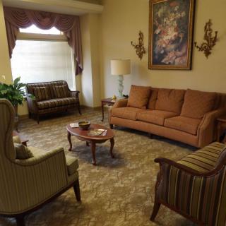 A cozy living room featuring comfortable seating and classic decor.