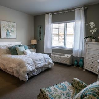 A serene and inviting bedroom featuring soft colors and elegant decor.