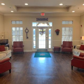 A cozy lobby with comfortable seating and decorative elements.