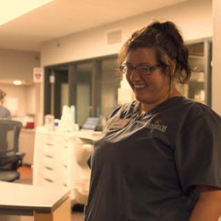 A healthcare worker shares a joyful moment in a hospital setting.