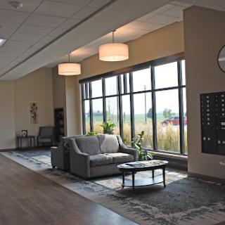 A modern lobby with comfortable seating and large windows allowing natural light.