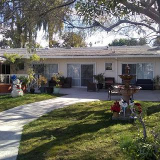 A charming residence with a well-kept garden and inviting front porch.
