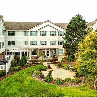 A well-maintained residential building with landscaped gardens.