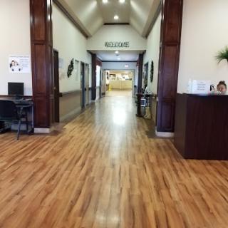 A spacious and well-lit hallway leading to a reception area.