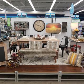 A beautifully arranged display showcasing various furniture and home decor items suitable for a cozy living space.