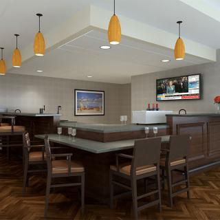 A modern bar and restaurant interior with stylish lighting, ample seating, and a television for entertainment.
