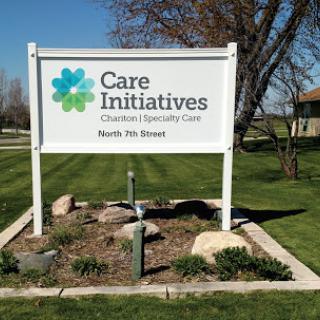 A sign for Care Initiatives, a healthcare facility located in North Iowa.