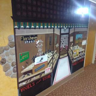 A mural depicting a floral shop with detailed storefront and interior design.