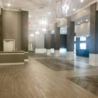 A spacious modern lobby with elegant lighting and contemporary design.