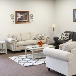 A cozy living room setup with neutral-toned furniture and decorative accents.