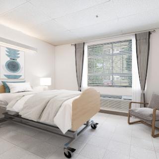 A modern hospital room featuring a comfortable bed, large window with curtains, and a chair, designed for patient care.