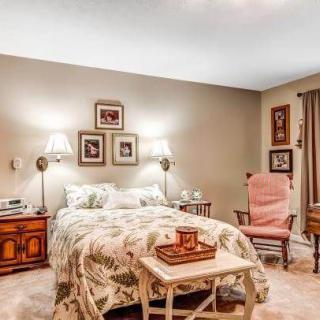 A cozy bedroom with vintage decor and comfortable furnishings.