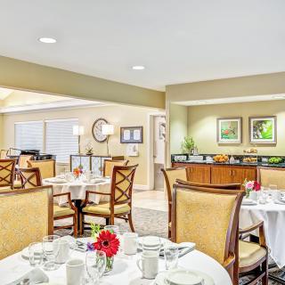 An elegant dining room with set tables and stylish decor.