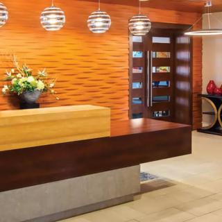 A modern reception area with wooden furniture and stylish decor.